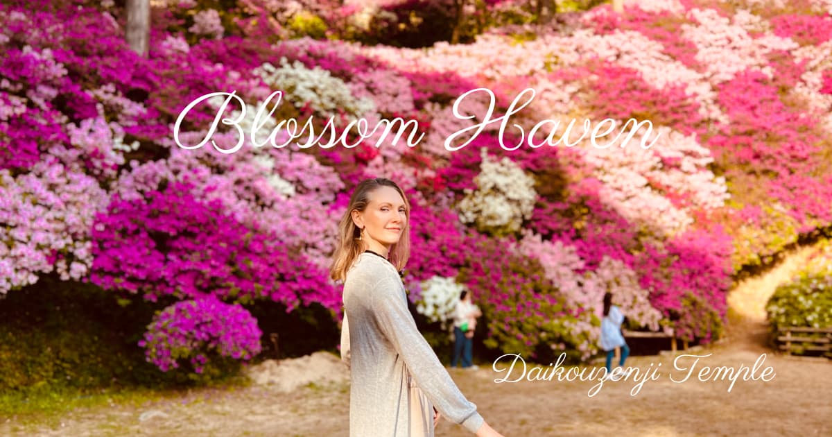 Anna surrounded by a multitude of azalea flowers at Daikoshoji Temple, the Blossom Haven.